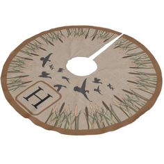 a clock with birds flying around it and the numbers e, f, and h