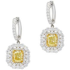 Earrings features GIA Certified Yellow Diamonds 1.51ct VS1 & 1.52ct VS1 of fancy light yellow cushion cut diamonds and 3.00 carats of white diamonds. Luxury Gold Danglers With American Diamond, Luxury Yellow Gold Bollywood Earrings, Luxury Yellow Halo Design Earrings, Luxury Yellow Gold Jewelry For Diwali, Yellow Diamond Earrings, Yellow Diamond Jewelry, Fancy Yellow Diamond Ring, Diamond Jewlery, Yellow Diamond Earring