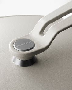 a close up view of the handle on an electronic device that is white and silver