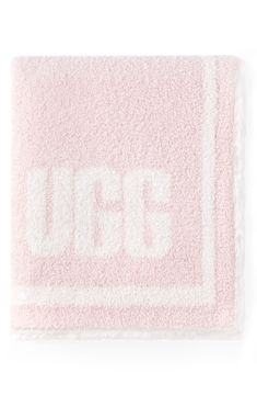 a pink and white towel with the word uff on it