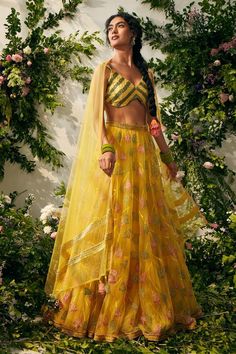 Yellow tulle, silk organza based attached cancan lehenga with resham embroidery, embellished with beads. Paired with raw silk padded blouse and dupatta with motif tassels.
Components: 3
Pattern: Embroidered
Type Of Work: Resham
Neckline: V neck
Sleeve Type: Sleeveless
Fabric: Tulle, Silk Organza and Silk Velvet
Color: Yellow
Other Details: 
Lehenga Length: 45 inches
Attached lining
Back deep neck blouse detailing
Tassel dupatta
Occasion: Wedding - Aza Fashions Yellow Organza Pre-draped Saree For Party, Yellow Anarkali Style Pre-draped Organza Saree, Navratri Organza Dresses With Sheer Dupatta, Silk Party Wear Choli With Sheer Dupatta, Yellow Organza Choli For Wedding, Sleeveless Organza Sets With Dupatta, Festive Organza Sets Sleeveless, Sleeveless Organza Sets For Festivals, Festive Sleeveless Organza Sets