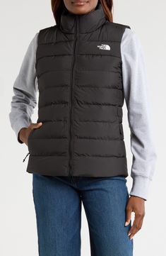 Experience the core warmth you need without restricting mobility in a lightweight puffer vest insulated with a blend of down and recycled polyester. 25 1/2" length (size Medium)   50-denier, 73 g/m² recycled polyester   Durable water-repellent (DWR) finish   Lined, with 50% 600-fill-power down, 50% recycled-polyester fill   100% recycled polyester   Machine wash, line dry   Imported   PFC-free, durable water-repellent coating is free of per- and poly-fluorinated chemicals, some of which can be h Black Puffer Vest, Outerwear Vest, Black Puffer, Quilted Vest, North Face Women, Puffer Vest, Outerwear Women, Stay Warm, Repellent