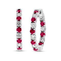 Draw all the right kinds of attention with the mesmerizing inside-out design of these red ruby and diamond alternating hoop earrings. Fashioned in 14K white gold Each hoop features 2.9mm bright red rubies alternating with 1/10 ct. shimmering diamonds along the outside front and inside back edges. These 1-1/4 ct. t.w. diamond earrings secure with hinged backs. Red Round Hoop Earrings Fine Jewelry, Yellow Diamond Necklace, White Diamond Necklace, White Diamond Earrings, Yellow Diamond Rings, Diamond Jewelry Necklace, Bridal Engagement Rings, Red Diamond, Bridal Bands