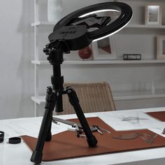 a tripod light sitting on top of a table