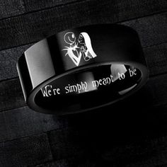 a black ring with the words we're simply meant to be engraved on it