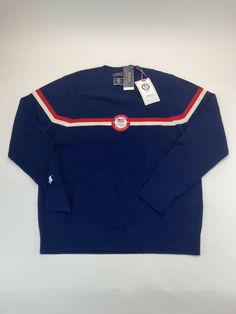 Polo Ralph Lauren Men's Team USA Merino Wool Sweater                                                                                                     New with Tags Show support for Team USA with Polo Ralph Lauren's crewneck sweater, which is finely knit from RWS-certified merino wool. It features the official logo patch of the U.S. Olympic Team woven from polyester and the iconic Polo Pony. Product Details: Imported Signature embroidered Pony above the right cuff Rib-knit hem Polo Ralph Laure Ralph Laure, Sweater Navy Blue, Polo Pony, Olympic Team, Team Usa, Merino Wool Sweater, Polo Ralph Lauren Mens, Crewneck Sweater, Wool Sweater