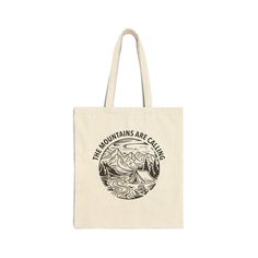 Embrace your love for the great outdoors with our 'The Mountains Are Calling' canvas tote bag. Featuring a beautifully illustrated mountain design, this tote is perfect for adventure enthusiasts and nature lovers. Whether you're heading to the farmers market, the gym, or your next outdoor adventure, this sturdy and stylish bag is the perfect companion. It's also a thoughtful gift for fellow adventurers and anyone who finds inspiration in nature. This 100% cotton bag comes in one size - 15" x 16"- perfect for everyday wear. While the canvas material will show off your designs in great colors, it's durable and will last for years. The bag features 20" handles (made from the same canvas), making it easy to carry even with a week's worth of shopping. - 100% cotton canvas - Heavy fabric (12 oz/ Practical Cotton Canvas Bag For Outdoor Activities, Practical Cotton Canvas Bag For Outdoor, Canvas Tote Bags For Outdoor Activities, Eco-friendly Canvas Tote Bag For Outdoor, Eco-friendly Canvas Travel Bag, Eco-friendly Travel Canvas Bag, Cotton Tote Bags For Outdoor Activities, Cotton Tote Bag For Outdoor Activities, Practical Canvas Bag For Hiking