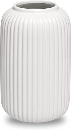 a large white vase sitting on top of a table