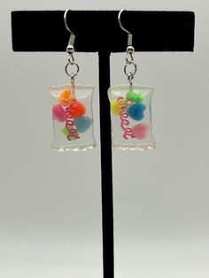 1 pair of hand crafted candy bag earrings  cute to go with any colorful outfit. disclaimer: quantity as well as color of heart flakes in the candy bag will vary and may not match the picture! Handmade Sweet Earrings For Party, Sweet Handmade Earrings For Party, Sweet Handmade Party Earrings, Sweet Multicolor Earrings For Gift, Sweet Handmade Earrings For Gift, Sweet Handmade Earrings As Gift, Sweet Hypoallergenic Earrings As Gift, Sweet Hypoallergenic Earrings For Gifts, Cute Colorful Earrings For Gift