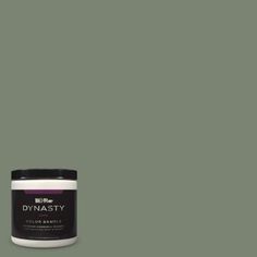 a green paint with the words dynastity on it and an image of a can