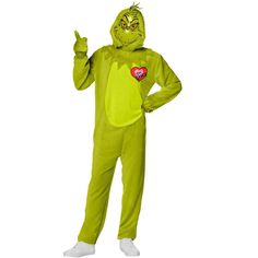 a man in a green costume is giving the peace sign with his hand while standing