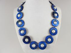 Statement mother of pearl  blue and white necklace,  blue and white shell Pearl Necklace Necklace, blue necklace, white  statement shell   Necklace is made from blue mother of pearl donut beads and white glass beads 10mm,  measures approx. 19" plus an additional 4" inches with silver extender. 1 Strands, light weight. Closure is a  lobster clasp with silver extender chain with bead dangle. My beautiful jewelry makes warm and personal gift for you, your family and friends, and all come in jewelry Blue Beaded Shell-shaped Necklace, Blue Beaded Shell Necklace, Handmade Blue Shell Beaded Necklaces, Elegant Handmade Blue Shell Necklace, Blue Shell-shaped Necklaces, Blue Shell Beaded Necklaces With Round Beads, Handmade Blue Shell-shaped Necklace, Handmade Blue Shell Necklaces, Handmade Blue Mother Of Pearl Jewelry