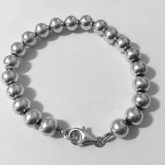 "This is a favorite style Sterling silver 8mm bead ball bracelet. Has lobster clasp closure for added security. Please note: Upto 1\" extender can be added at no additional cost. Must convo me, to let me know. Approx. 7\" Sterling silver bead ball bracelet Approx. 8mm Bead Ball size beads Approx. 14.3 grams REF: \"7\" Sterling Silver 8mm Bead Ball\" Bracelet" Classic Sterling Silver Bracelet With 8mm Beads Gift, Classic Sterling Silver Bracelet With Polished Beads, Classic Silver Beaded Bracelets, Classic Adjustable Sterling Silver Bracelet With Polished Beads, Classic Sterling Silver Bracelet With 8mm Beads, Classic Adjustable Sterling Silver Bracelet With Spacer Beads, Classic Sterling Silver Bracelet With Beads, Adjustable Sterling Silver Clasp Bracelets With Round Beads, Classic Adjustable Beaded Bracelets, Nickel Free