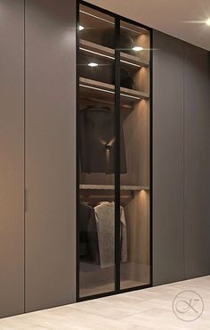 an empty walk - in closet with glass doors