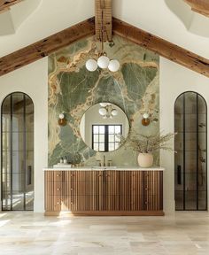 an elegant bathroom with marble and wood accents