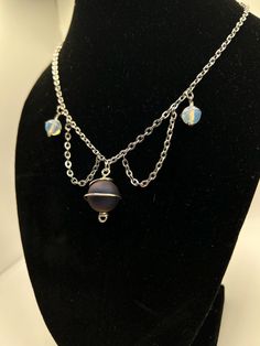 Elevate your style with this stunning Rainbow Druzy Agate and Opalite Planet Charm Choker! Handcrafted with vibrant colors and mystical vibes, this celestial-inspired piece is perfect for adding a pop of energy to your outfits. Embrace the cosmic trend and stand out from the crowd with this unique choker necklace. Unleash your inner cosmic queen with our Rainbow Druzy Agate and Opalite Planet Charm Choker! This eye-catching accessory features a beautiful combination of gemstones that shimmer in the light. Whether you're a fan of celestial jewelry or just love vibrant colors, this choker is a must-have addition to your collection. Make a bold statement with our handcrafted Rainbow Druzy Agate and Opalite Planet Charm Choker! Crafted with care and attention to detail, this stunning necklace Purple Adjustable Celestial Jewelry, Adjustable Purple Celestial Jewelry, Handmade Mystical Multicolor Jewelry, Celestial Iridescent Adjustable Jewelry, Handmade Multicolor Celestial Jewelry, Cosmic Queen, Unique Choker Necklaces, Unique Choker, Celestial Jewelry