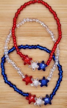 Red, white & blue star stretch stack bead bracelet - select 1 color or choose more than 1 for the 4th of July.  Made with glass beads and each are 7 1/2 inches.   Created by Kelly in the USA! Please do not over stretch, may result in breakage.  Never leave small children unattended with items containing small pieces, potential choking hazard.  Beads may change colors over time if worn in water or while applying products to the skin such as lotions. Check out my Etsy store for bracelets and more Bead Bracelet Ideas, Forth Of July, Bracelet Ideas, Star Bracelet, Stretchy Bracelets, Blue Star, Star Shape, Bead Bracelet, Red White Blue