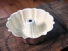 a cake pan sitting on top of a wooden table