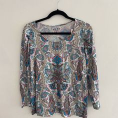 Long Tee With A Multi-Colored Paisley Design Long Sleeve Paisley Print Patterned Top, Long Sleeve Paisley Print Tops, Cotton Paisley Print Patterned Tops, Casual White Shirt With Paisley Print, Spring Paisley Print Patterned Shirt, Patterned Paisley Print Shirt For Spring, Spring Paisley Print Shirt, Casual Blue Paisley Print Tops, Multicolor Paisley Print Shirt For Spring