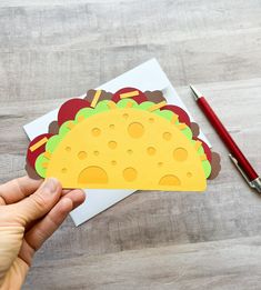 This taco shaped gift card holder makes the perfect gift for the foodie in your life!  The card is shaped like a taco.  The opens up so you can add your gift card inside.  It comes with an envelope and lies flat to be mailed.   **Gift card NOT included** All orders over $35 ship FREE! Please see other gift card holders and cards at https://thesunnypaperstudio.etsy.com This gift card holder will be mailed to you in a plastic sleeve and an envelope or box, depending on the size of your order. Dimensions: Approximately 7 inches tall and 5 inches wide (at the top).  It comes with an A7 envelope. Taco Card Ideas, Restaurant Gift Card, Birthday Gift Card Holder, Taco Gifts, Birthday Gift Card, Gift Card Holders, Holiday Deals, Gift Card Holder, Blank Greeting Cards