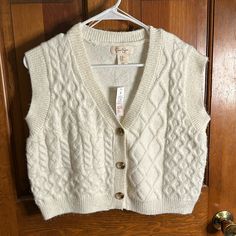 Nwt Super Cute Oversized Fit Extremely Soft Easy To Layer White Cable Knit Button-up Outerwear, Cream Knit Button-up Sweater, Casual Soft Knit Beige Sweater Vest, Cream Cotton Sweater Vest For Winter, Cream Button-up Knit Sweater, Fall Beige Sweater Vest With Buttons, Casual Beige Soft Knit Sweater Vest, Cream Knit Top With Button Closure, Beige Buttoned Sweater Vest Casual