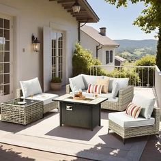 an outdoor living area with wicker furniture