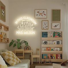 a living room filled with furniture and pictures on the wall