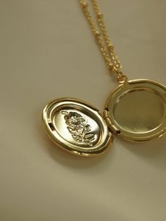 A vintage-inspired locket necklace with a fully functional locket to store little pictures of those close to your heart.

Gold base colour
14k Gold plating

Measurements. Length 52cm + 5cm extension. Dainty Gold Plated Pendant Locket Necklace, Gold-tone Gold Plated Locket Necklace Gift, Gold Plated Tarnish Resistant Locket Pendant Necklace, Gold Plated Tarnish Resistant Locket Necklace As Gift, Gold-plated Tarnish-resistant Locket Necklace As Gift, Gold Plated Tarnish Resistant Pendant Locket Necklace, Gold Plated Tarnish Resistant Locket Necklace, Keepsake Gold Necklace With Delicate Chain, Vintage Gold Medallion Necklace Tarnish Resistant