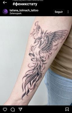 a woman's arm with a bird tattoo on it