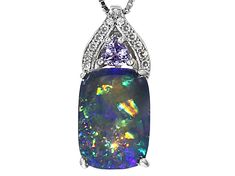 14X10mm rectangular cushion cabochon Australian opal triplet with .18ct trillion tanzanite and .12ctw round white zircon rhodium over sterling silver slide with chain. Measures approximately .94"L x .38"W. 2.5mm bail. Lobster clasp. 2" extender. Finished back. Elegant Multi-stone Opal Gemstones, Formal Opal Jewelry With Gemstone Accents, Opal Jewelry With Gemstone Accents For Formal Occasions, Elegant Tanzanite Jewelry With Trillion Cut, Elegant Opal Jewelry With Gemstone Accents, Elegant Trillion Cut Tanzanite Jewelry, Formal Opal Gemstone Jewelry, Cushion Cut Tanzanite Jewelry Gift, Cushion Cut Tanzanite Jewelry For Gifts