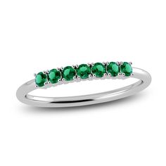 A playful balance between generous sparkle and minimal style, this gorgeous 10K white gold ring, adorned with shimmering natural emerald gemstones, makes the perfect gift (or keep for yourself). Substantial enough to wear on its own, or style comfortably stacked with other rings from your collection. From the Juliette Maison collection. Emerald Band Ring, Emerald Band, Jared The Galleria Of Jewelry, Ring White Gold, Half Eternity Ring, Minimal Style, Emerald Gemstone, White Gold Ring, Natural Emerald