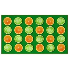 oranges and limes arranged in rows on green background with white border around them