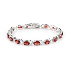 Introducing our Red Garnet Bracelet, a unique piece of jewelry that combines style and elegance. This handmade bracelet, crafted with 925 Sterling Silver, is more than just an accessory. It's a statement of sophistication, a testament to beauty, and a perfect gift for the special person in your life. Key Features: Red Garnet Gemstone: The bracelet features a captivating red garnet gemstone, known for its deep red color and its ability to inspire love and devotion. Birthstone Bracelet: Red Garnet Elegant Garnet Bracelets For Formal Occasions, Elegant Natural Ruby Gemstones, Garnet Gemstone Bracelet Jewelry, Elegant Garnet Gemstone Bracelets, Elegant Jewelry With Garnet Natural Stones, Formal Garnet Gemstone Bracelets, Elegant Jewelry With Garnet And Natural Stones, Elegant Garnet Gemstone Bracelet, Elegant Garnet Jewelry With Natural Stones