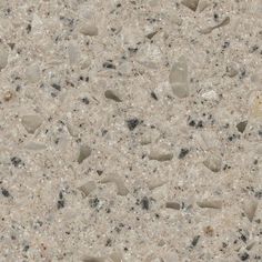 a close up view of the surface of a marbled surface with small rocks and gravel