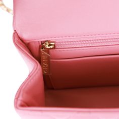 This Mini Rectangular flap bag is in dark pink lambskin with light gold tone hardware and has a front flap with signature CC turnlock closure, rear half moon pocket, top handle and single interwoven dark pink leather and light gold tone chain link shoulder/crossbody strap. The interior is lined in dark pink leather and features a zipper pocket with Chanel pull and an open pocket below. Collection: 22A Origin: Italy Condition: Pristine; new or never Accompanied by: Chanel box, Chanel dustbag, felt, carebook and ribbon Measurements: 8.5" width x 6" height x 3" depth; 1.77" top handle, 22.5" strap drop Chanel Mini Rectangular, Chanel Box, Chanel Mini, Shopping Chanel, Pocket Top, Somali, Diaper Backpack, Sierra Leone, Pink Leather