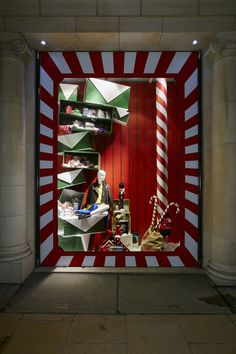 a store window with red and white stripes on it