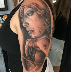 a woman's arm with a tattoo on it