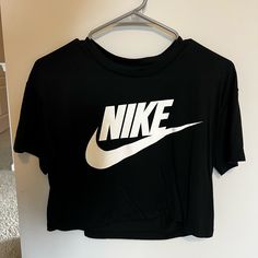 Nike Cropped Tee Size Small Never Worn Nike Black T-shirt For Spring, Basic Black Cropped T-shirt For Spring, Trendy Nike Top With Letter Print, Nike Black Summer T-shirt, Trendy Nike Sports Tops, Trendy Nike Short Sleeve Tops, Nike Basic Graphic Print Top, Nike Basic Top With Graphic Print, Trendy Nike Top With Graphic Print