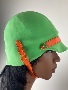 Fabulous pea green helmet swim cap with orange chin and visor strap. Great mod styling for a great Carnaby Street/That Girl look.  Outside fabric feels to be a stretch nylon, which is bonded to an inner latex/rubber/plastic layer (not sure which). Cap is in very good to excellent condition, with some cracking in the underlayer and a small pull or on the outside. Retro Green Bucket Hat, Green Retro Bucket Hat, Fitted Retro Green Hat, Retro Fitted Green Hat, Green Fitted Retro Hat, Retro Green Brimmed Hat, That Girl, Cap Outfit, Crochet Swim