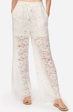 These mostly-sheer lace pants with a wide-leg silhouette give off that perfect boho vibe. 29" inseam; 23 1/2" leg opening; 11 1/2" front rise; 17 3/4" back rise Elastic/drawstring waist Front slant pockets Partially lined 60% nylon, 40% cotton Dry clean Imported Elegant Wide Leg Lace Pants, Lace Bottoms For Summer Loungewear, Full Length Lace Pants, Summer Lace Pants With Lace Trim, Full-length Lace Bottoms With Lace Trim, Full Length Lace Bottoms With Lace Trim, Spring Lace Long Pants, White Lace Long Pants, Lace Beach Bottoms With Lace Trim