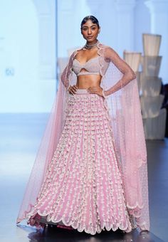 Onion pink chandelier pearl lehenga clubbed with an intricately hand embroidered blouse and dupatta.