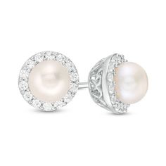 Make a wonderful impression with these beautiful pearl stud earrings. Crafted in sterling silver, each breathtaking earring features a lustrous 6.0mm cultured freshwater pearl wrapped in a frame of shimmering petite lab-created white sapphires. Polished to a bright shine, these post earrings secure comfortably with friction backs. Pearl White Cubic Zirconia Round Earrings, Elegant Diamond White Birthstone Earrings, Elegant Diamond White Earrings With Birthstone, Classic Sterling Silver Pearl Earrings For Anniversary, Pear-shaped Akoya Pearl Silver Earrings, Pearl White Cubic Zirconia Pearl Earrings, Elegant Birthstone Earrings In Cubic Zirconia, Classic Round Cut Sterling Silver Pearl Earrings, Gift Cubic Zirconia Pearl Earrings