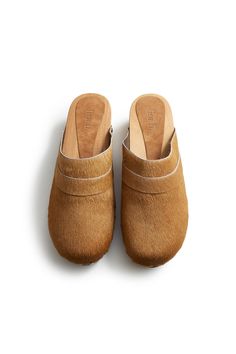 Cow hair classic low heel leather clogs in camel. Comfortable 1 7/8" pine wood mid heel. Leather lined. Made in Spain. Fit is true to size. Half sizes should order up. Save SaveSave