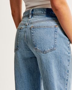 Our classic low rise baggy jeans in a medium wash with a raw hem. This fit features a 8.5” low rise, is slightly relaxed at waist and hips, and eases at the thigh into a baggy, full-length leg shape. We recommend buying your true size for a baggier fit. Size down for a closer fit. This jean is made from our vintage stretch fabric which features both an authentic vintage look and contains slight built-in stretch for additional comfort. Relaxed Fit Jeans With Frayed Hem In Rigid Denim, Classic Rigid Denim Flare Jeans For Everyday, Classic Medium Wash Flare Jeans For Summer, Classic Flare Jeans In Rigid Denim For Everyday, Medium Wash Straight Hem Cropped Jeans, Classic Flare Jeans With Frayed Hem For Everyday, Everyday Cropped Flare Jeans In Recycled Denim, Medium Wash Relaxed Fit Flare Jeans In Recycled Denim, Medium Wash Relaxed Fit Flare Jeans In Rigid Denim