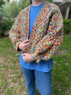 This cute and comfy cardigan is perfect to add a pop of color to your outfit! This sweater is a size medium with a bit of an oversized look to it. Hand crocheted makes this a unique one of a kind sweater to go with your unique style! Spring Cozy Sweater In Acrylic Yarn, Cozy Acrylic Yarn Sweater For Spring, Oversized Chunky Knit Cotton Cardigan, Trendy Crochet Sweater For Fall, Trendy Fall Crochet Sweater, Multicolor Soft Knit Cardigan For Fall, Colorful One Size Fall Cardigan, Fall Multicolor Soft Knit Cardigan, Colorful One Size Cardigan For Fall