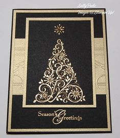 a black and gold card with a christmas tree on it