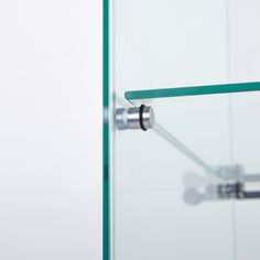 a glass door with a metal handle on the bottom and one piece of glass behind it