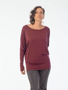 Relaxed and effortless, our lightweight long sleeve has dolman sleeves and a wide neckline. It narrows at the hips creating a flattering shape. [#details] Loose silhouette Extra-long sleeves Thumbholes One Size (O/S) [/details] [#fabric] Lightweight Rayon Lycra: 90% Rayon (Viscose) / 10% Spandex (Lycra) [/fabric] Versatile Relaxed Fit Top For Fall, Versatile Stretch Long Sleeve Top For Fall, Relaxed Fit Long Sleeve Top For Everyday Fall, Versatile Long Sleeve Top With Thumbholes For Fall, Fall Stretch Tops With Batwing Sleeves, Fall Stretch Batwing Sleeve Tops, Casual Batwing Sleeve Long Sleeve Top For Fall, Casual Batwing Sleeve Top For Fall, Slouchy Batwing Sleeve Tops For Fall