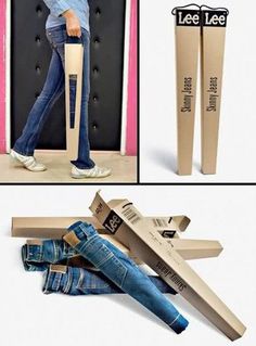 there is a cardboard airplane next to a pair of jeans