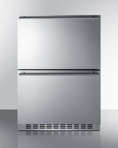 a stainless steel refrigerator freezer sitting on top of a counter